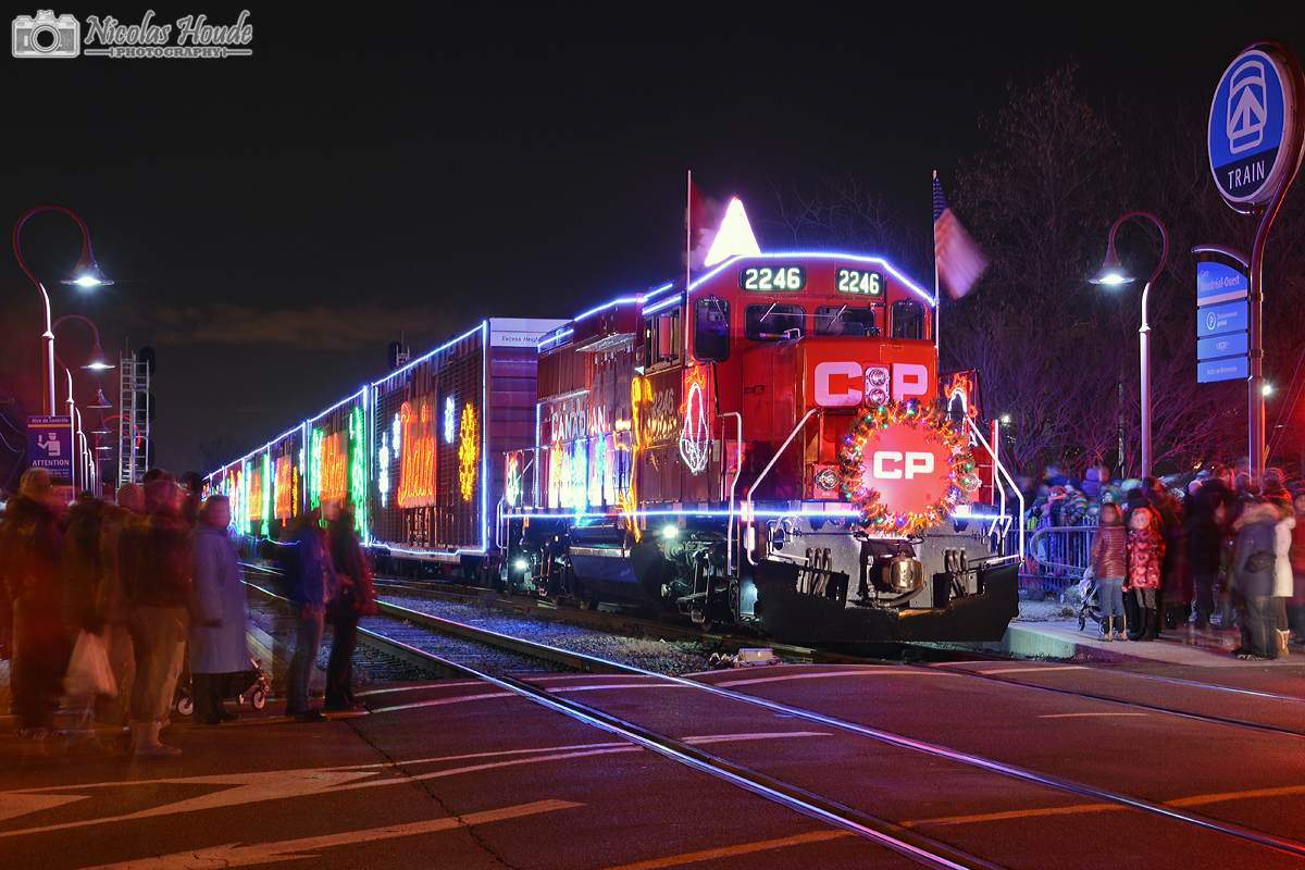 The CP Holiday Train Canadian version makes its first stop at Montreal West, Qc. Lots of people was here. For 2014, the CP Holiday Trains, U.S. version and Canadian version, will have GP20C-ECO leaders.