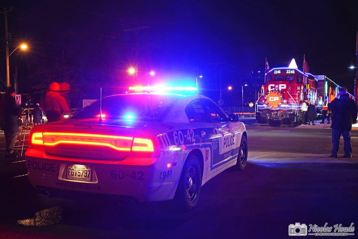 The CP Holiday Train Canadian version makes its first stop at Montreal West, Qc. Lots of people was here. The Police of Montreal was here to support the CP Police to protect the crossing.