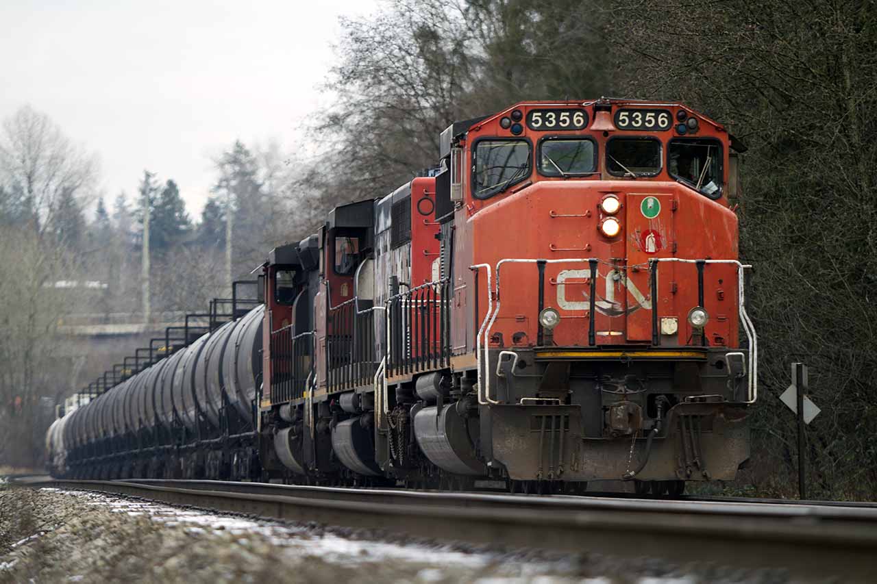 CN locomotive 5356 hauling a load of tank cars west towards Douglas Road in Burnaby.