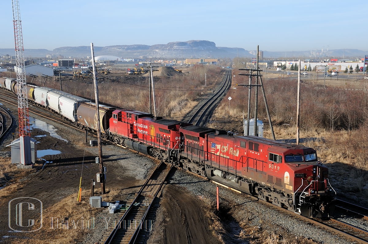 In this typical view of the Thunder Bay North crossing as seen from Central Ave, CP 340 takes some head room out of the 'New Yar', stringing out across both CP mains and the CN Kashabowie Sub.