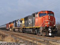 CN 5705, CSXT 9025, and BNSF 6928 eastbound at Heritage Road.