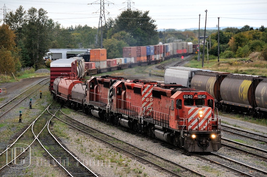 Prior to the recession in 2008/09, CP hosted more trains along its "north route" through Canada. Here is a train was one of the first to hit the chopping block, Winnipeg to Toronto manifest 222. It was distinguished by the block of intermodal traffic on its head end with a mix of manifest traffic spread throughout the rest of the train. Seen here running through the yard in Westfort due to congestion ahead on the mains. It also was prone to hosting CP's aging GMD fleet. This days addition had SD40-2's CP 6040-CP 6022-CP 5952.