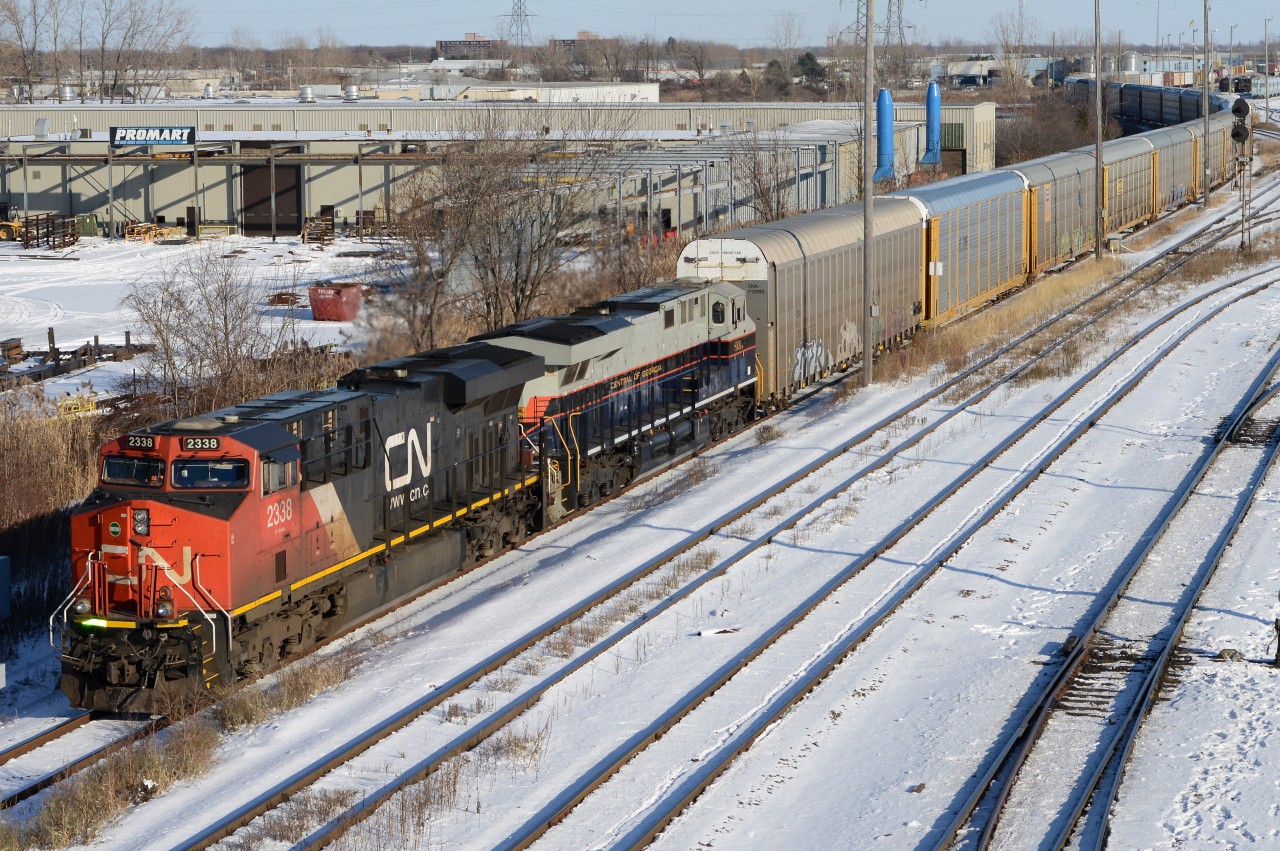 CN2338 leads train 393 towards the St. Clair River Tunnel with Norfolk Southern Heritage unit 8101 "Central of Georgia"