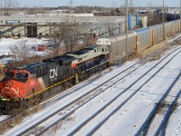 CN2338 leads train 393 towards the St. Clair River Tunnel with Norfolk Southern Heritage unit 8101 "Central of Georgia"