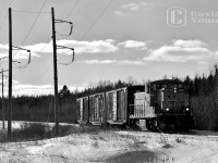 Trundling down the remaining active portion of the Kinghorn Sub, a CN extra utilizing GMD1 1439 leads 3 boxes destined for Thunder Bay packaging on the northeastern side of the city.