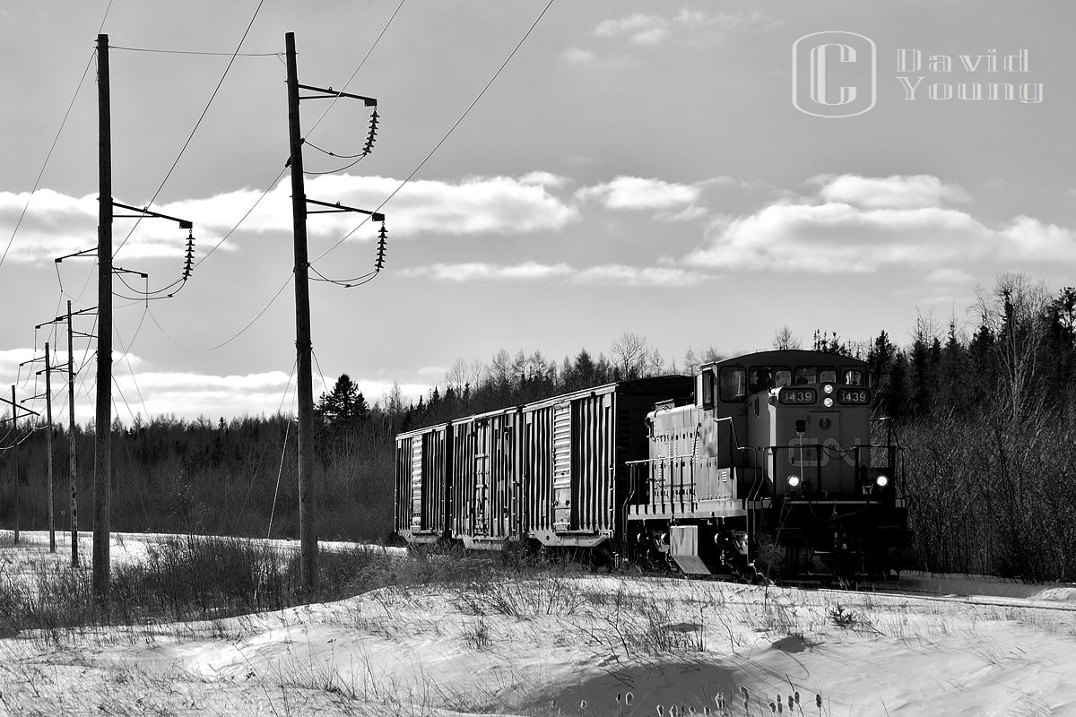 Trundling down the remaining active portion of the Kinghorn Sub, a CN extra utilizing GMD1 1439 leads 3 boxes destined for Thunder Bay packaging on the northeastern side of the city.