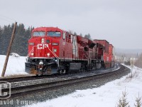 CP 8862 East (wearing her 2010 Vancouver patch) snakes out of the Kam valley and is about to crest the heavy grade at Mile 16 and descend into Thunder Bay where fueling and crew change will take place at mile 2.7. CP's SD90Mac's were common on CP's Canadian trans-con between Winnipeg and Toronto, and an unidentified one here is providing the additional ponies behind the 8862.