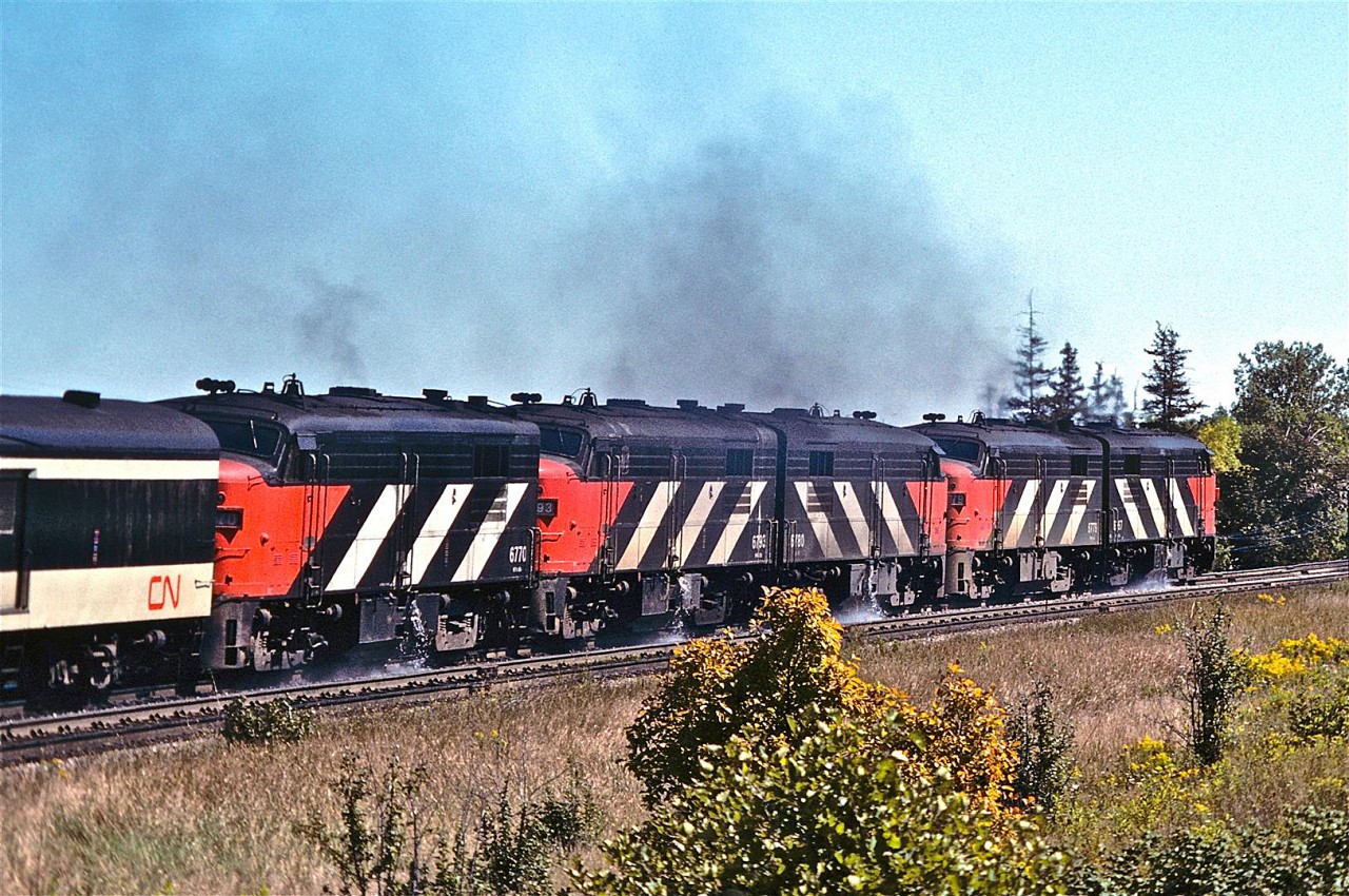 There is nothing like a five-pack of speeding, smoking, thundering, water-sloshing FPA-4s!  I think this image was snapped somewhere around Scarborough Golf Club Road, circa 1978.


My research shows that the Montreal Locomotive Works built 34 of these units (numbered 6760 – 6793).  They were manufactured between 1958 and 1959, and were each rated at 1,800 HP.


Want to see some additional water spillage?  Check out Mr. Danko’s  fantastic photograph at…