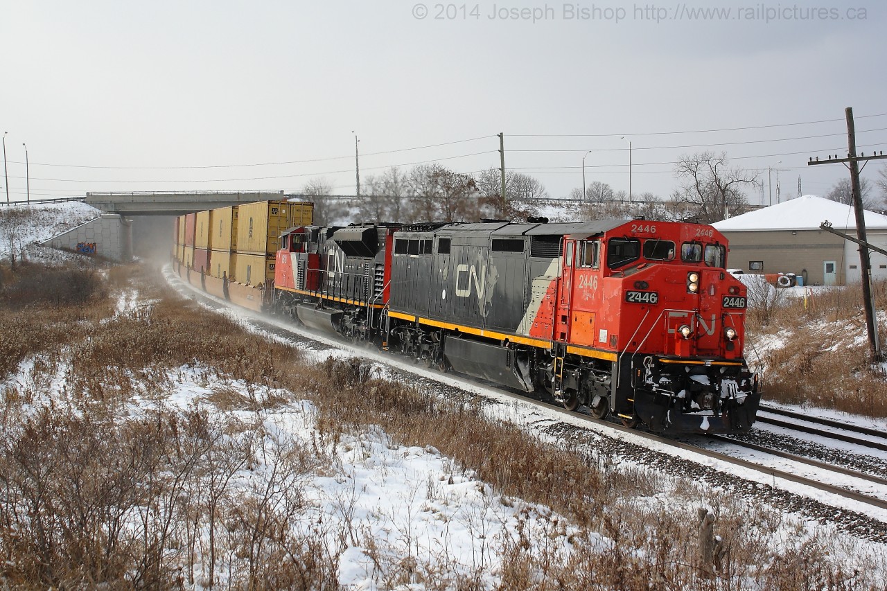 CN 148 leans into the curve at Garden Ave with CN 2446 leading the way.  The day before Southern Ontario received its first dose of winter weather making this my first snow shot of the season