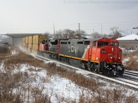 CN 148 leans into the curve at Garden Ave with CN 2446 leading the way.  The day before Southern Ontario received its first dose of winter weather making this my first snow shot of the season