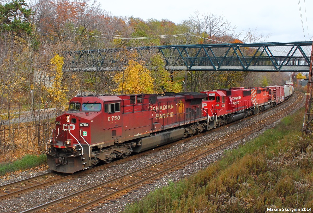 A CP WB headed for the MacTier Subdivision (Likely CP 421 or CP 301) is wasting no time getting by, and is seen unexpectedly passing Rosedale in this photograph. The consist was CP 9750, CP 6221 and CP 5919, adding some taste to the usual boring GE's. However, I'd like that leader swapped outa' there!