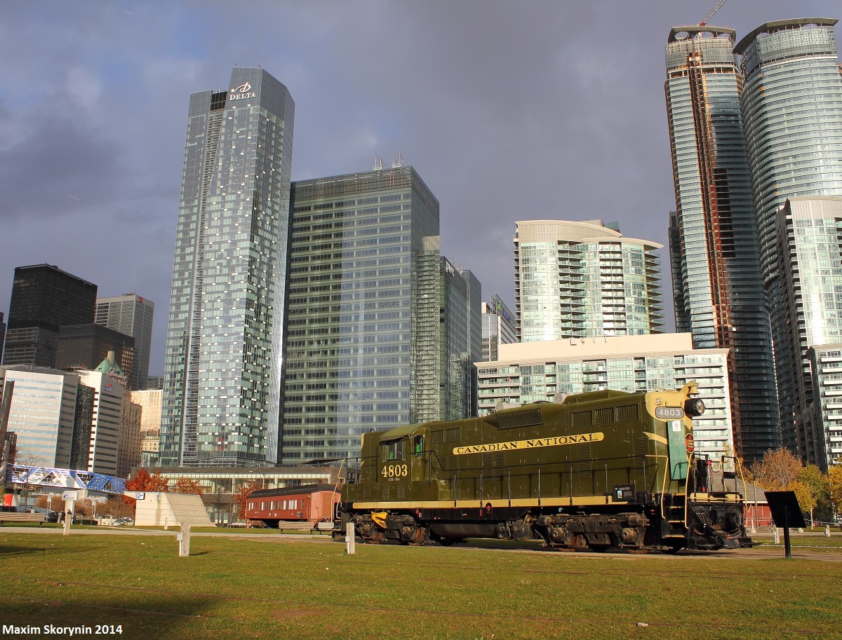 In just under 2 weeks, I'm back at the Roundhouse with some friends to grab more shots, on an overall trip to downtown Toronto. Here is retired Canadian National #4803 sitting in the sunshine under the city skyline, with quite some mean looking clouds passing overhead.