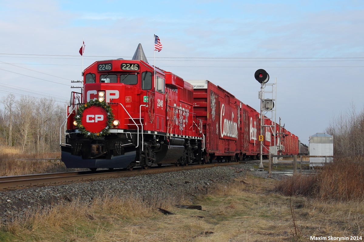 The 2014 version of the CP Holiday Train, now using the newer GP20C-ECO locomotives instead of the AC4400CW's, tears through the small town of Grafton, Ontario towards its next show stop in Bowmanville. Visit cpr.ca for the Holiday Train schedule. At each stop, admission is free and spectators get to watch a performance from the train. However, bringing a non-perishable food item for a local food bank is highly recommended!