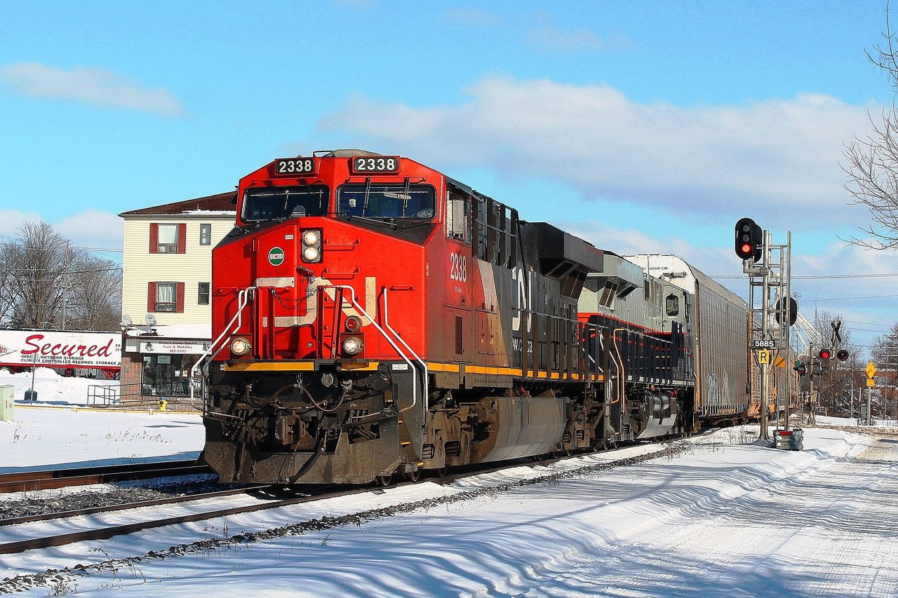Having seen 393 pass by me at Woodstock in a train generated blizzard I glimpsed that the second unit was a NS Heritage. Having not seen one of these units before, I drove down to Ingersoll station and waited for two hours for 393 to finish switching. The wait was more than worthwhile as 2338 led NS 8101 at a steady pace.