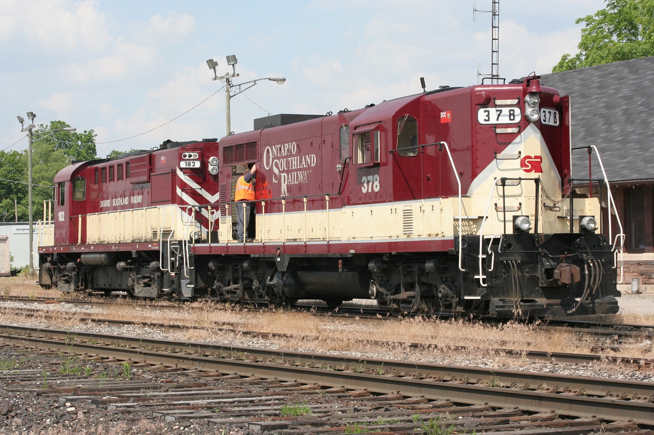 More Ontario Southland. Paired OSR units OSRX 182 and OSRX 378 rest in front of the Woodstock depot. I'm not sure where or how I got the symbol "OSRX" (someone is welcome to comment). The date is June 18, 2011. It is nice to see the matching paint schemes.