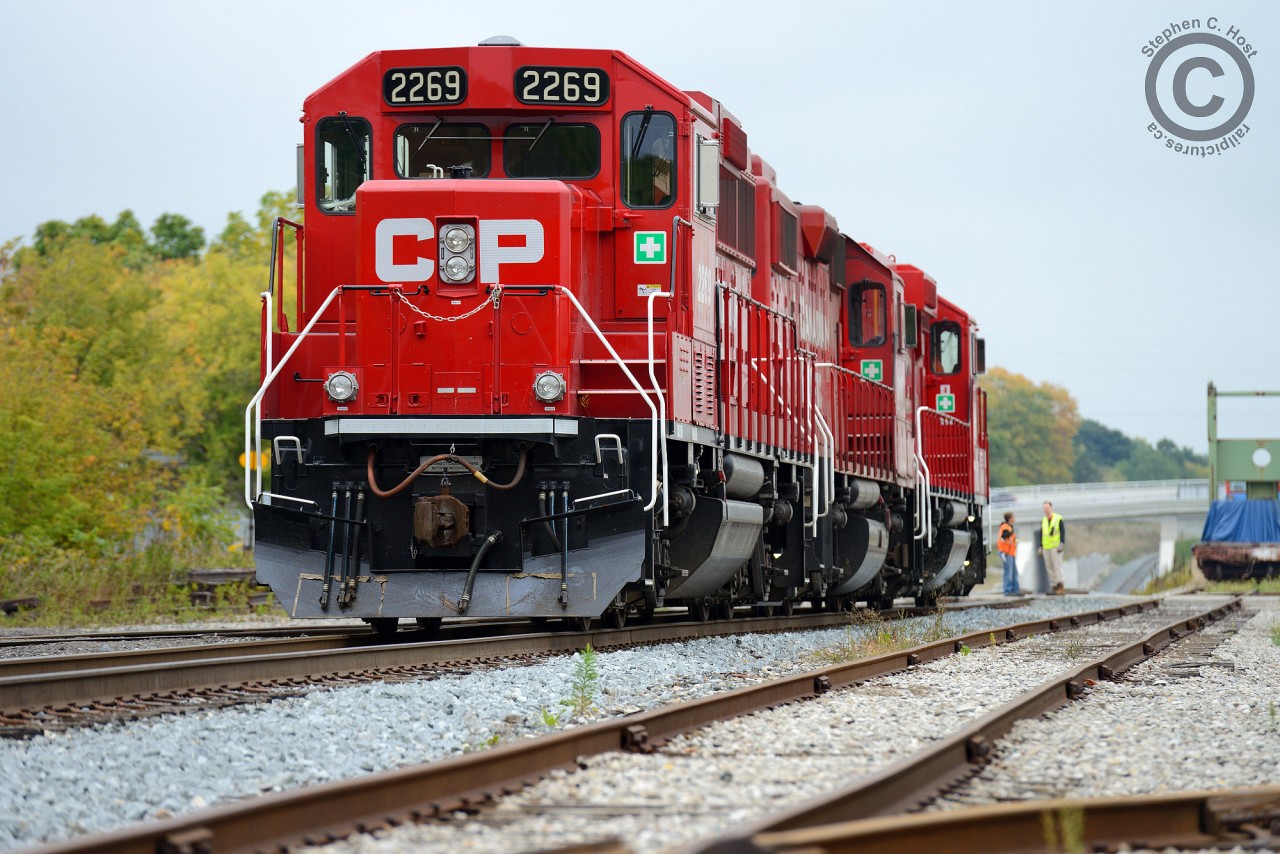 A trainee on Wolverton to Hagey turn T72 (CPR Cambridge/Toyota yard) is getting instruction on the next move - due to a work block on the Galt subdivision T72 will tie down on the CN/GEXR Fergus spur (at far left) for the night. Pass switch, throw switch for the Fergus, return switch to normal and tie train down for the night, most notably applying the new procedures for securing the train.
This is the southernmost point for the GEXR/CN Fergus spur, and GEXR switches the plant and track at right. Years ago there was a CN/CP (GRR) interchange just beyond the underpass but the Fergus sub continued another 40 miles to Lynden Junction. Furthermore CN RDC's used this route between Toronto, Guelph, Palmerston over the Fergus until 1970. Anyone able and willing to make this shot a candidate for the time machine?