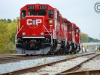 A trainee on Wolverton to Hagey turn T72 (CPR Cambridge/Toyota yard) is getting instruction on the next move - due to a work block on the Galt subdivision T72 will tie down on the CN/GEXR Fergus spur (at far left) for the night. Pass switch, throw switch for the Fergus, return switch to normal and tie train down for the night, most notably applying the new procedures for securing the train.<br><br>This is the southernmost point for the GEXR/CN Fergus spur, and GEXR switches the plant and track at right. Years ago there was a CN/CP (GRR) interchange just beyond the underpass but the Fergus sub continued another 16 miles to Lynden Junction. Furthermore CN RDC's used this route between Toronto, Guelph, Palmerston over the Fergus until 1970. Anyone able and willing to make this shot a candidate for the <a href=http://www.railpictures.ca/time-machine>time machine?</a>