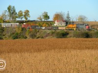 GEXR 432 is seen passing by fields of gold and a really neat stone farmhouse on this beautiful fall morning.