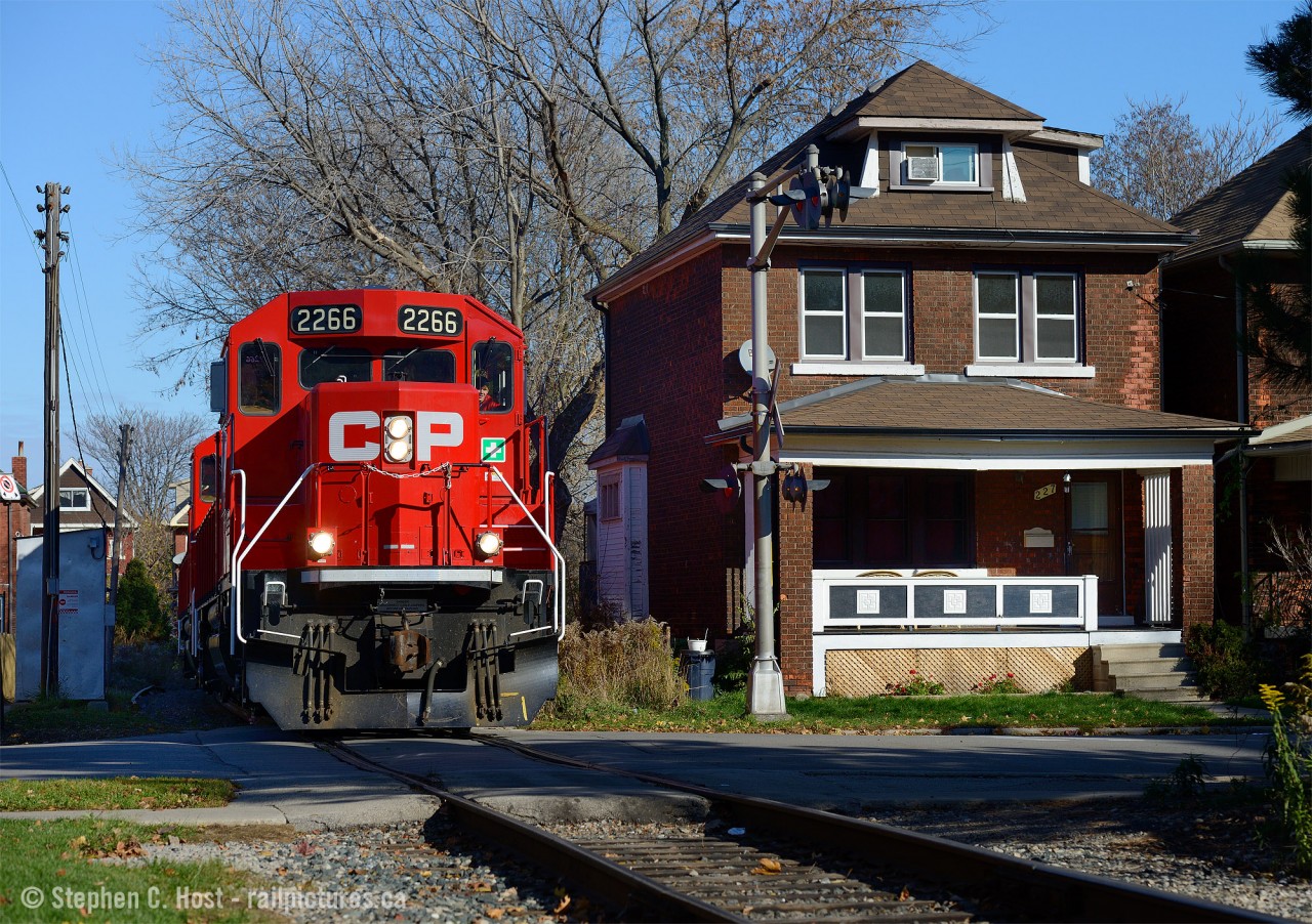 Former TH&B Track winds through tightly built residential neighbourhoods near Gage Park in Hamilton. The Belt Line was built to serve the growing Steel industry in 1911 - the source of significant traffic for the TH&B and CPR and continues to thrive to this day. In this photo a CP Kinnear local is returning from switching National Steel Car, A&M Metals, and Railcare and will head to Aberdeen yard for more work.