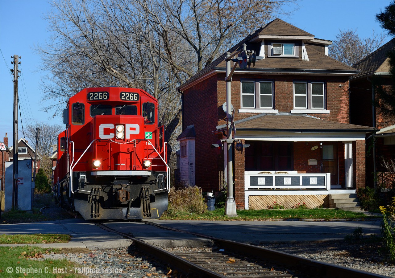 Former TH&B Track winds through tightly built residential neighbourhoods near Gage Park in Hamilton. The Belt Line was built to serve the growing Steel industry in 1911 - the source of significant traffic for the TH&B and CPR and continues to thrive to this day. In this photo a CP Kinnear local is returning from switching National Steel Car, A&M Metals, and Railcare and will head to Aberdeen yard for more work.
