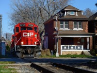 Former TH&B Track winds through tightly built residential neighbourhoods near Gage Park in Hamilton. The Belt Line was built to serve the growing Steel industry in 1911 - the source of significant traffic for the TH&B and CPR and continues to thrive to this day. In this photo a CP Kinnear local is returning from switching National Steel Car, A&M Metals, and Railcare and will head to Aberdeen yard for more work.

