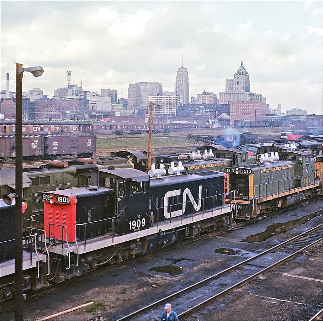 The late Del Rosamond centered most of his railroad photography around Pembroke, Ontario.  Apparently, even Del had the occasional urge to get out of town.  He captured this image not far from the Spadina roundhouse sometime around 1961.  GMD1, #1909 (Class GR-12n) was built in 1958.  It was retired in December, 1995.  Original equipment included a steam generator.


This image might be a great candidate for RPca’s “Time Machine” challenge.