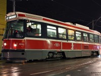 The TTC's fleet of 52 articulated ALRV streetcars rule the 501 Queen, but smaller CLRV's do show up from time to time - often in times of car shortages or changeoffs, whatever is left in running condition at the carhouse or yard gets send out. TTC CLRV 4045, bound for Long Branch, pauses near Queen and Victoria on a wet evening.
<br><br>
A gleam of what the photographer was doing this particular evening can be seen reflected in one of the windows, prior to his boarding of another 501 car not too long after pressing the shutter.