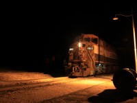 Boo! This BC Rail unit leads an oil train as a fresh crew waits for a clear signal out of Rivers on a spooky Halloween night.