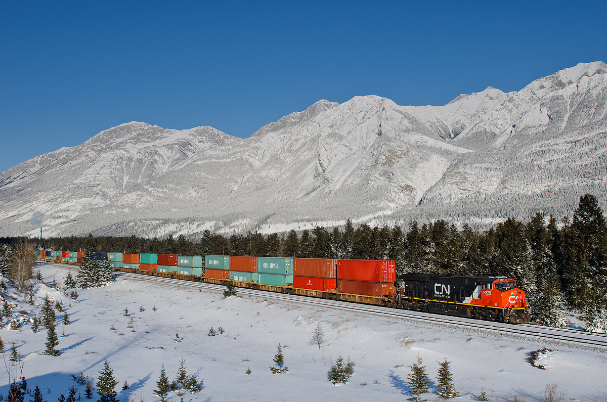 Toronto-Robert's Bank stack train Q105 creeps up to the light at English on a frigid, but clear -28C day.