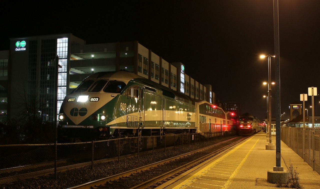 GO Transit MP40PH 603 is holding track 3 and has just completed its station stop at Oakville, while a westbound train races along track 2 and heads for Aldershot.