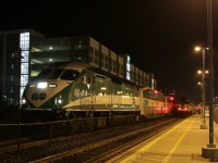 GO Transit MP40PH 603 is holding track 3 and has just completed its station stop at Oakville, while a westbound train races along track 2 and heads for Aldershot. 