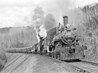 Both 815 and 1057 have their safety valves popping as firemen Russ Cook and Don Atkinson have their engines hot to produce all the steam they can for this, the most difficult part of the upgrade climb.