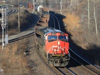 A few days before the big day and yet no snow, one can only hope and dream of a white Christmas. CN 2591 solo rolls through Hamilton West  on CN 384 
