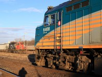 With 5 cars in tow CN 580 patiently waits for its shot out of the yard as VIIA train 71 departs Brantford.  