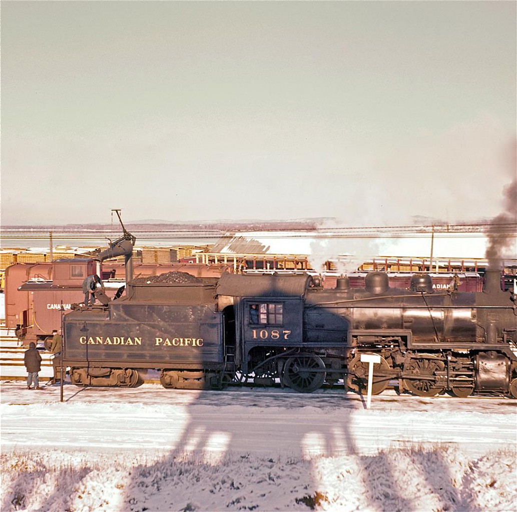 I'm guessing that most of the regular viewers on RPca are aware of the recently restored Del Rosamond collection. Of all the images, this particular photograph has generated the most comments... it is kind of funny, but people either really like or dislike this shot. 


As an aside, two things remain unchanged from that cold day, circa 1960, when Del took this picture: the river... and the water-tower. Yes, the water-tower that Del climbed for this shot is still there!  In fact, the City of Pembroke is well known for their large-scale public murals. The side of this same water-tower now features a painting of the Pembroke CPR stone station (long gone) and CPR Pacific-type #1223 (long gone).


Personally, I like this shot... and I hope you do too.