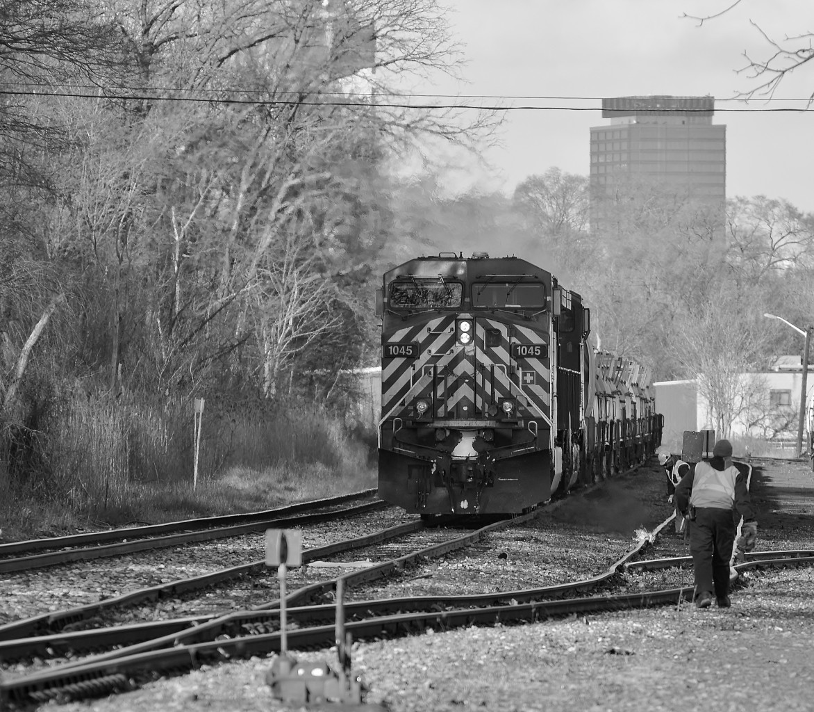 CP Train 246 pauses at Kinnear to set of a string of coil cars before heading south on the final day of 2014. The crew provided some water to the MoW crew who needed a little assistance putting out the fire they started to relax the rail they had been working on.