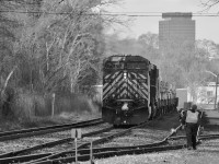 CP Train 246 pauses at Kinnear to set of a string of coil cars before heading south on the final day of 2014. The crew provided some water to the MoW crew who needed a little assistance putting out the fire they started to relax the rail they had been working on.
