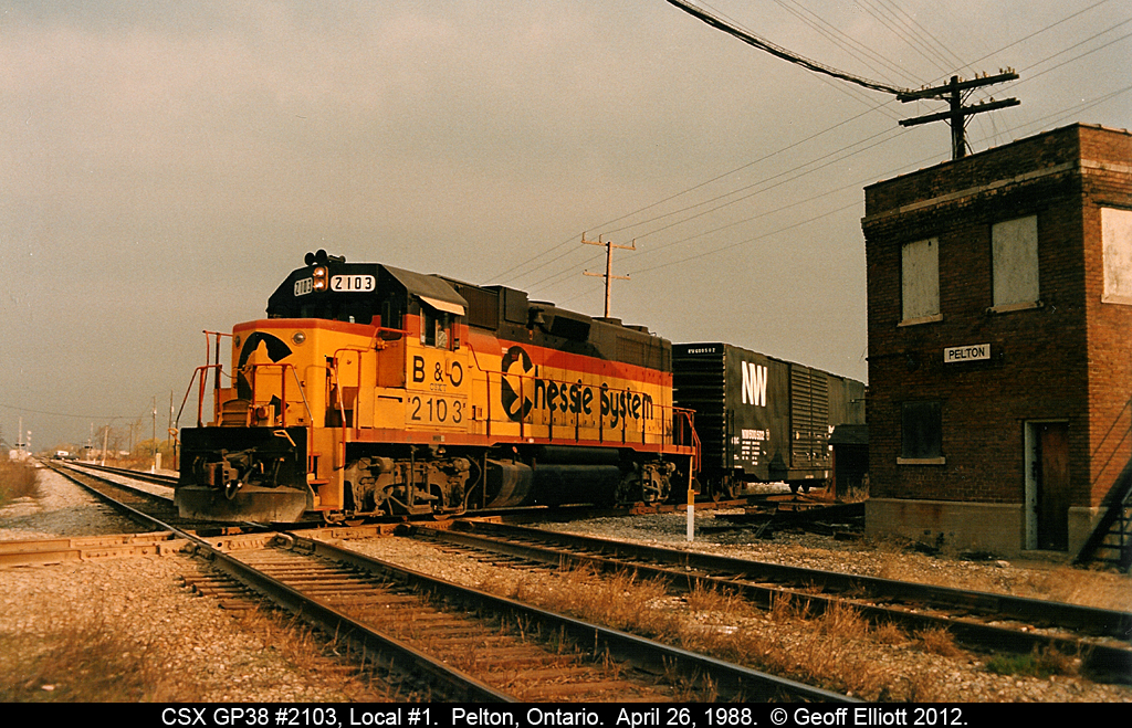 CSX (Chessie) GP40 #6841 leads two other kittens as train R321 passes the old Pelton Tower on the former NYC/PC/CR Canada Southern as crosses C&O 'home' rails on the diamond.  R321 originated in Buffalo and skirted across Southern Ontario via the CASO to it's destination at Rougmere Yard in Dearborn, Michigan.