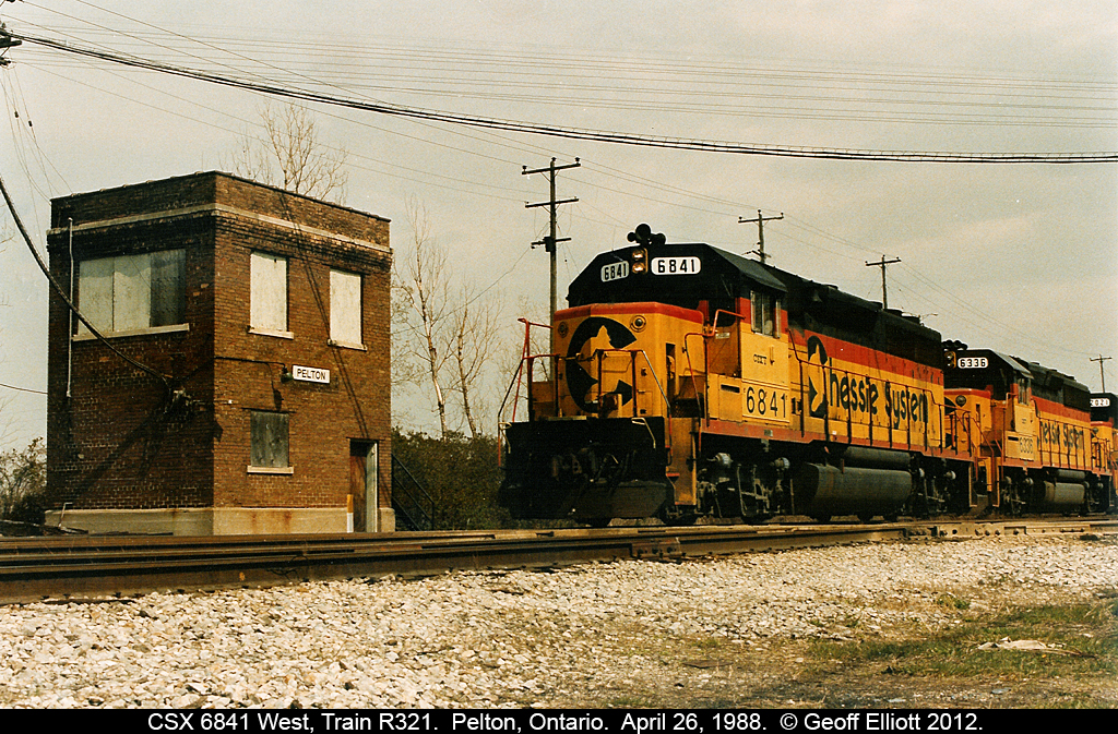 CSX (Chessie) GP40 #6841 leads two other kittens as train R321 passes the old Pelton Tower on the former NYC/PC/CR Canada Southern as crosses C&O 'home' rails on the diamond. R321 originated in Buffalo and skirted across Southern Ontario via the CASO to it's destination at Rougmere Yard in Dearborn, Michigan.