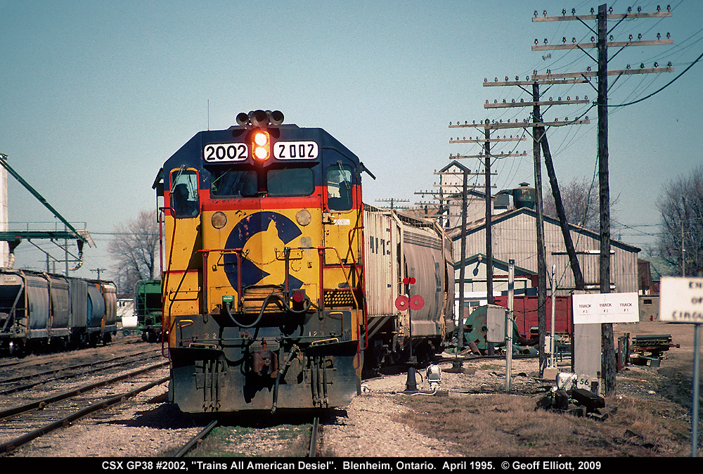 CSX 2002 makes another appearance in Blenheim, Ontario in April of 1995 as it moves grain cars around town for both W.G. Thompson and Kent Grain facilities.  This shot shows the different number board styles on the unit at this time and the slight 'list' to the left gives the photo character in my opinion.
