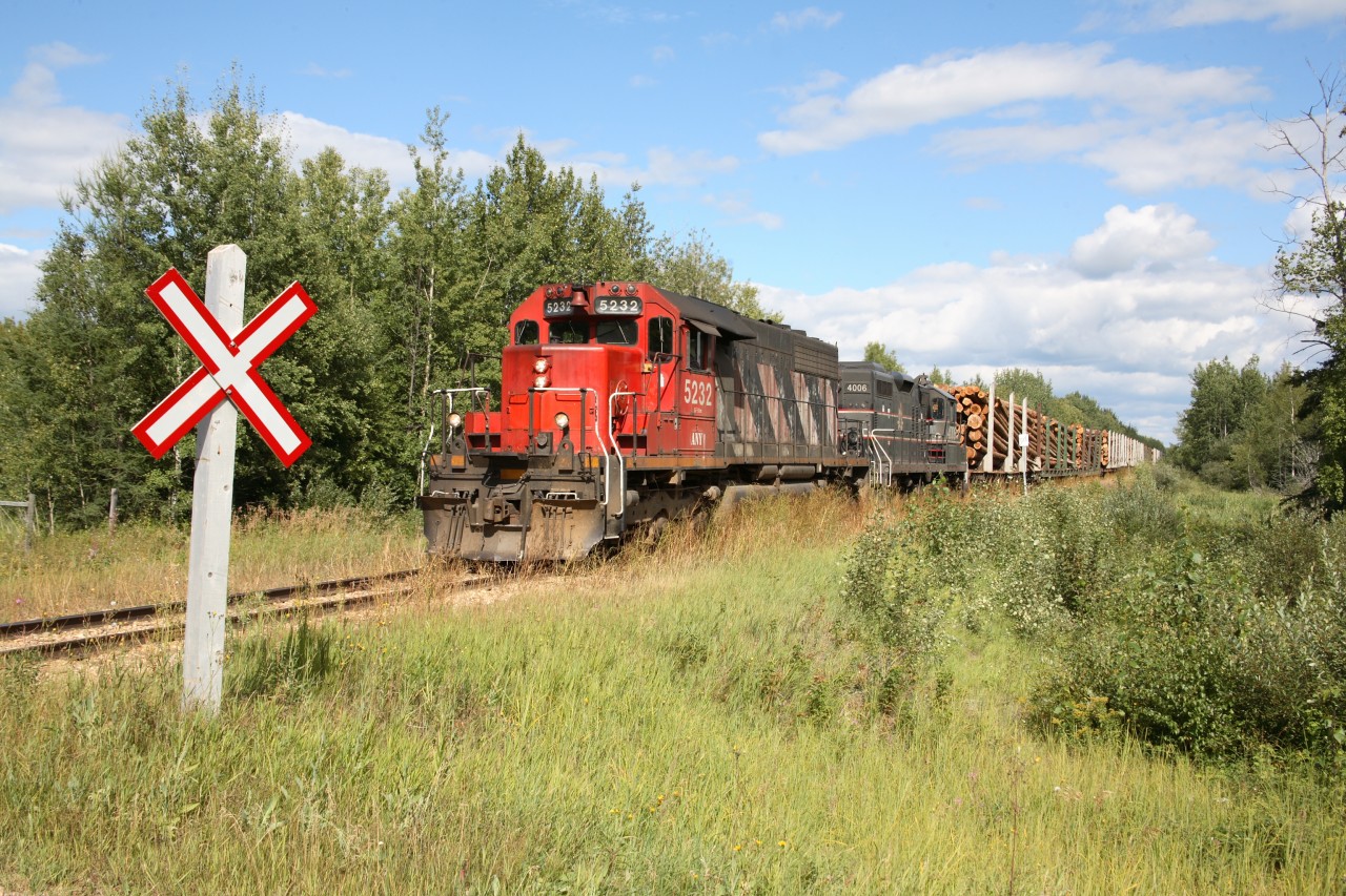 B610 arrives at the first crossing south of Lac La Biche for a crew trade-off.  We will take this train to Boyle, switch out the log cars then leave the rest of the train for CN.  We'll then change ends, and with 4008 leading, lift the interchange cars from CN and head north as 609.  5232 was a rough rider, and ANY crews nick-named her "waltzing Matilda".