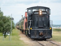 Led by Alberta Prairie's 1118, a GMD1m, the day's train pulls into the station at Big Valley. 1118 was originally a CN unit, then to Canadian Railserve in 1997, Central Western Railway in 5/1998, and finally Alberta Prairie.