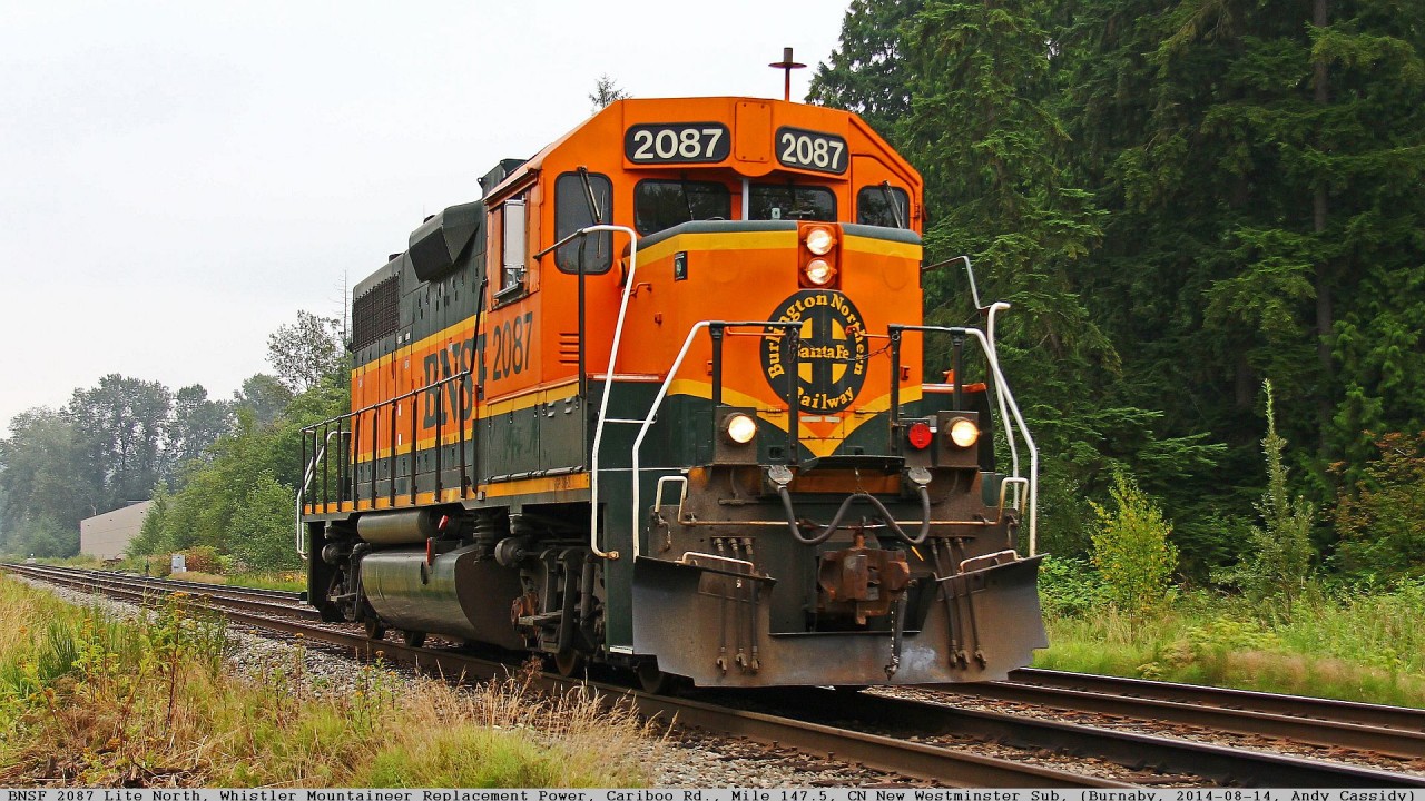 I got word from reliable sources, saying that because the Rocky Mountaineer locomotive RMRX 8018 was in at VIA getting a wheelset replaced, the BNSF 2087 will be filling the gap. The RMRX 8018 is one of the units handling the “Whistler Mountaineer”, Rocky’s day tour train travelling between North Vancouver and Whistler return. $$. 

The plan was for a Rocky crew to taxi over to the BNSF New Westminster Terminal (not far from my place), at between 1230 and 1300 Hrs to pick up the BNSF 2087 (EMD GP38-2). Then they would travel Lite Engine over to the North Shore to assume second position on the Whistler Mountaineer from Friday till Monday.
