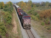 A CEFX maroon and grey SD90MAC leads, what I think is, CP 254 towards Fort Erie. The trailing units are CP 9537 and CP 8519. I wonder what became of these locomotives; many were kicking around on CP at this time, including on another train before this one on the same day with CEFX 118 and SOO 6045 (candy apple red).