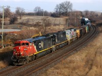 CN 2444 - IC 1025 - KCS 3916 lean into the curve at Garden Ave with a late running CN 385