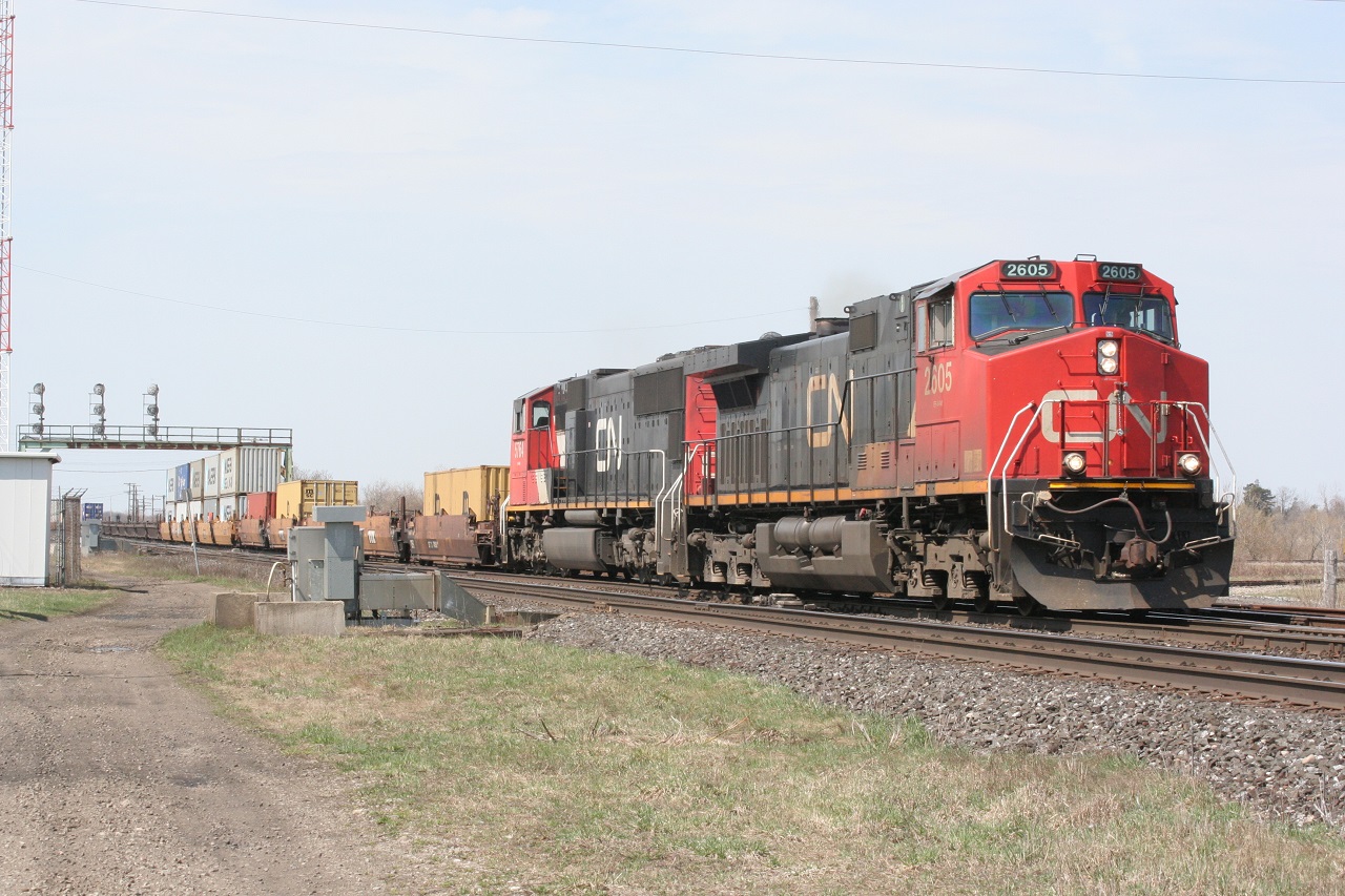CN 2605 and an SD75i head east with containers on a sunny spring day in 2009.