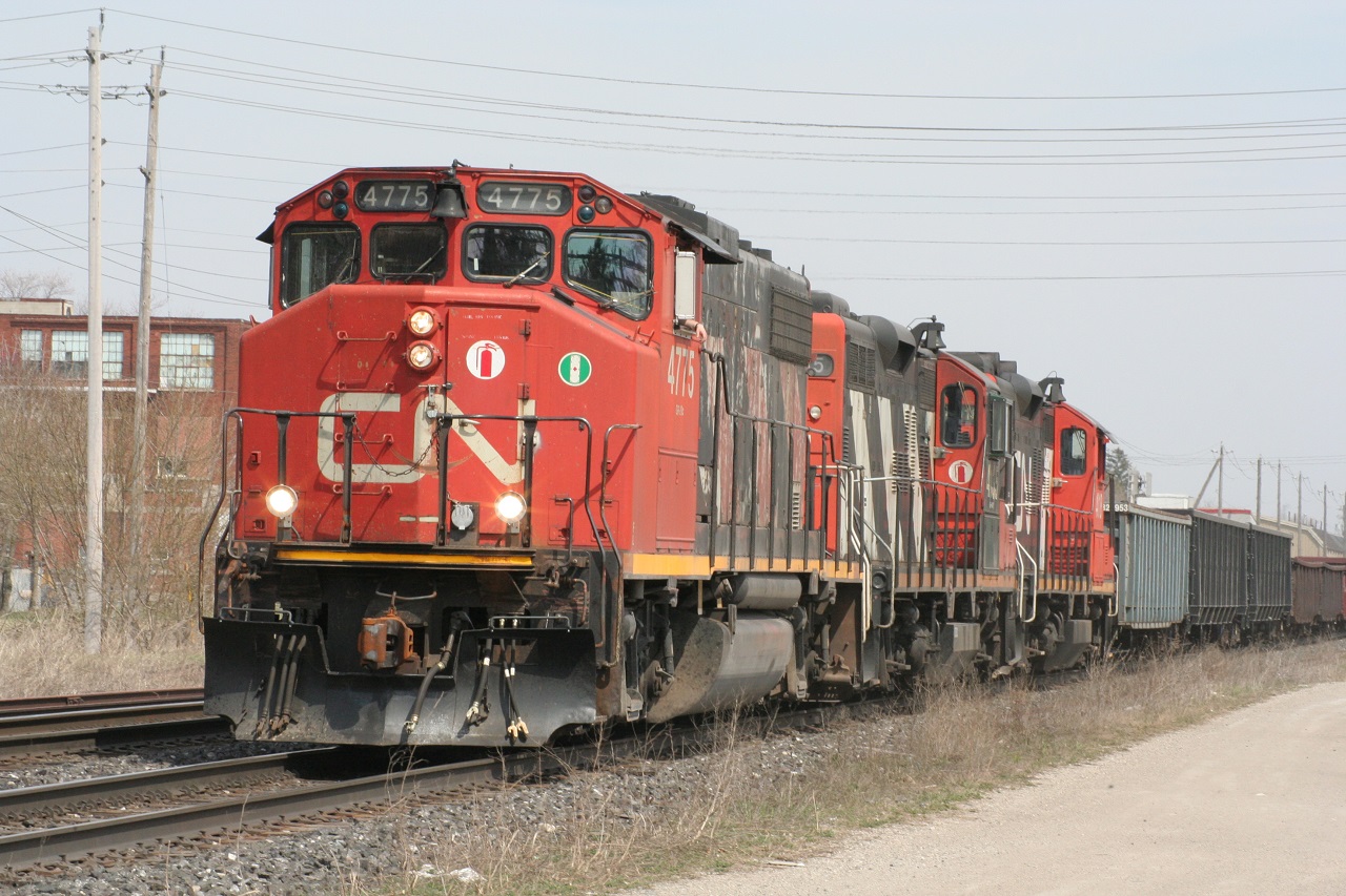 CN 4775 leads two GP9s and a short train towards the Woodstock VIA station on a pleasant spring afternoon.