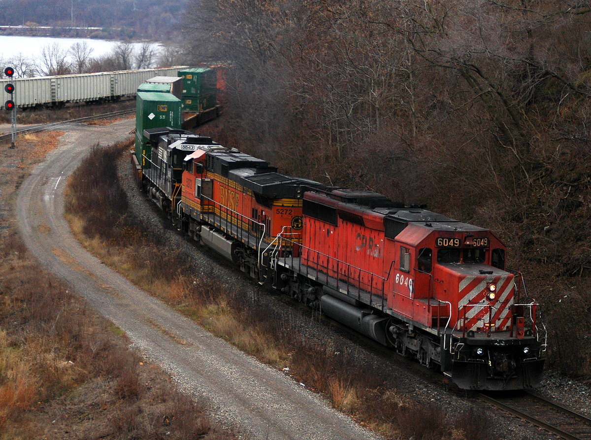CP 142 starts up the grade to Guelph Jct with CP 6049 - BNSF 5272 - NS 8843 leading 116 cars