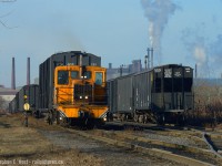 Deep in the north end of industrial Hamilton - at the end of Parkdale Ave N. lies a small yard called Strathearne by SOR. Rich in history and quite busy - sometimes you get lucky. This was the second time in four years  I've found Columbian Carbon switching with their March 1957 built GE 45 Tonner. The crew is seen switching cars in the Strathearne yard and the engine is on the Strathearne yard mainline. <br><br>
Four train operators use this track - in recent weeks both SOR and CP can be found switching customers here - behind me is A&M Metals who also acquired a trackmobile for the sprawling metals recycler. Add in Columbian and that's up to four operators in a very small section of track. How about the history? From what I can tell - this track is actually the last remaining segment of the Hamilton Radial Electric Railway which ran along the Beach Strip to Burlington and was abandoned in 1929.