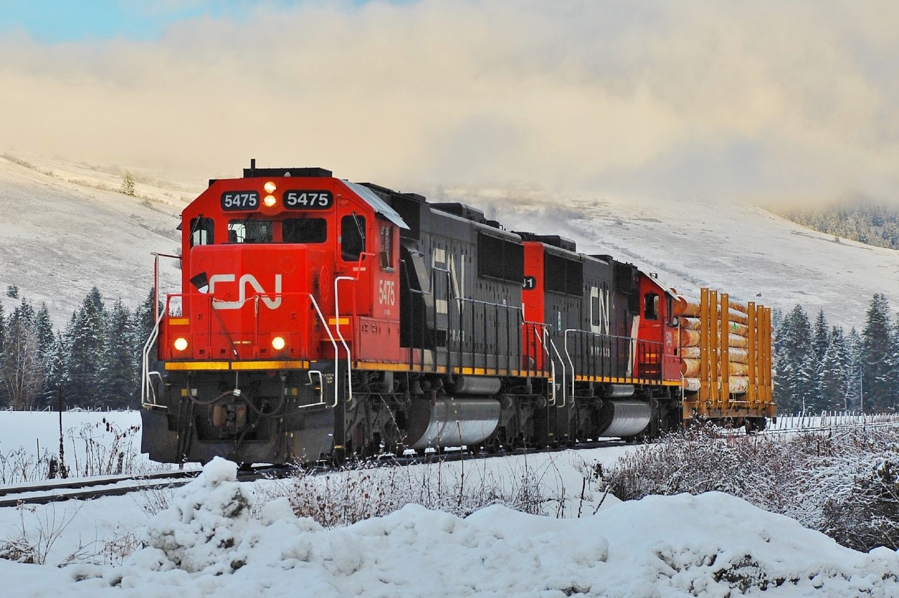 CN nos.5475 & 5441 have picked up a single pole car in Lumby and are approaching Lavington where it will be added to a train load of lumber that is destined for Kamloops later in the day.